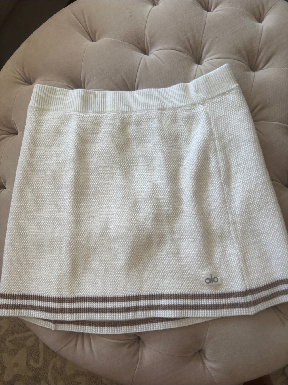 ALO Yoga Cream Knit Mini Skirt with Brown Striped Hem